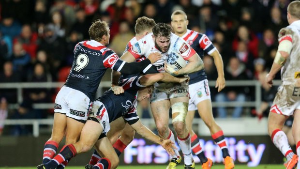 A handful: England forward Alex Walmsley playing for St Helens against the Sydney Roosters in the World Club Challenge last year.