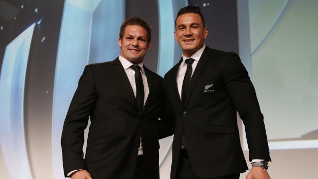 Richie McCaw presents Sonny Bill Williams with his replacement medal, after he gave his original medal to a young fan. 