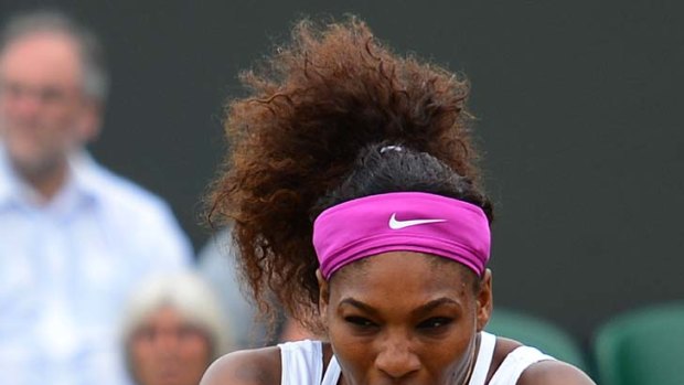Serena Williams puts her all into a backhand.