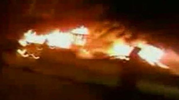 A still image is seen taken from video footage posted under the title "Tripoli protesters set ablaze police station at Souq Al Jum'uah". A Reuters reporter confirmed that police station was on fire.