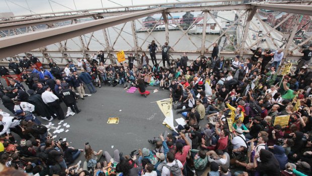 Occupy Wall Street protesters stage a rally on New York's Brooklyn Bridge before hundreds were arrested.