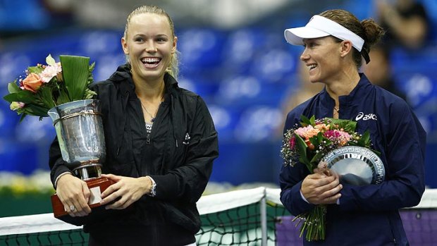 Australia's Samantha Stosur, right, looks on at victor Caroline Wozniacki after the women's singles final at the Kremlin Cup.