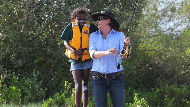 Premier Anna Bligh fishing with Shakeria Tarpencha during her visit to Pormpuraaw.