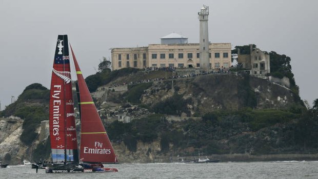 Emirates Team New Zealand sails in front of Alcatraz Island during the 13th race of the America's Cup.