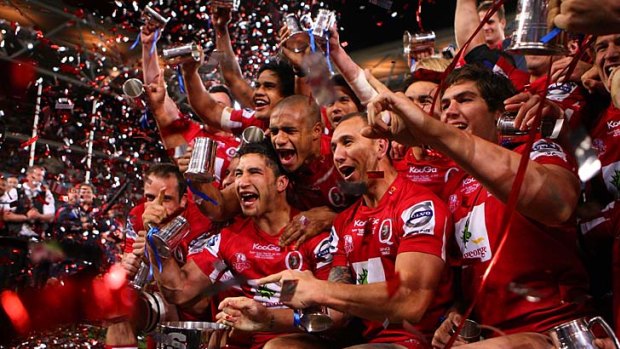 The Queensland Reds celebrate their victory in the 2011 Super Rugby grand final. The Age union expert Stathi Paxinos expects a repeat this year.