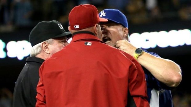 Not happy: Mark McGwire (right) of the Los Angeles Dodgers has words with Arizona Diamondbacks' manager Kirk Gibson in 2013.