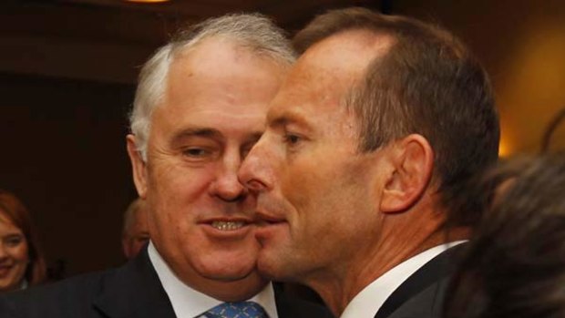 Tony Abbott shakes hands with former Opposition Leader Malcolm Turnbull. <i>Photo: Glen McCurtayne</i>.
