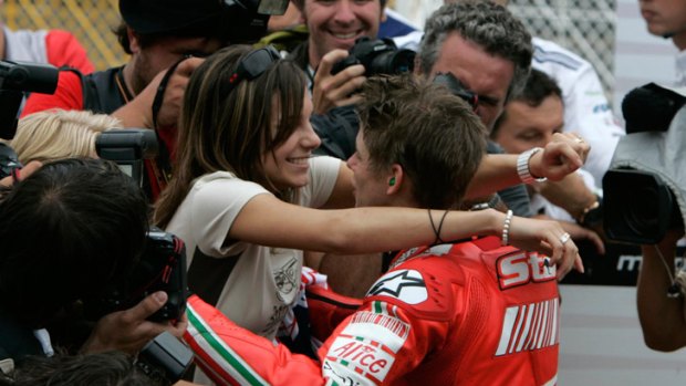 Family man ... Casey Stoner is congratulated by wife Adriana at the Japanese GP in 2007.