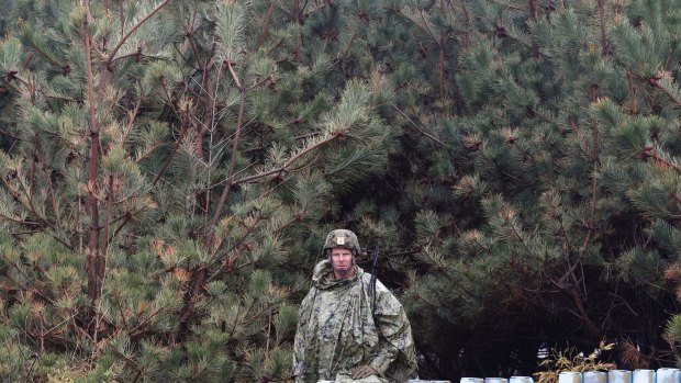 An American soldier stands guard during the US-South Korea joint exercise in Pohang, South Korea, last Tuesday.