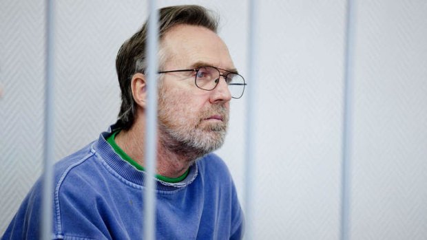 Greenpeace International Australian activist Colin Russell behind bars during a bail hearing at a Murmansk court.