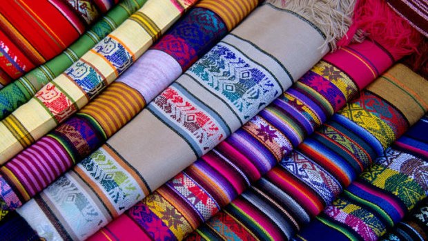 The Otavalo markets are abound with colourful rugs.