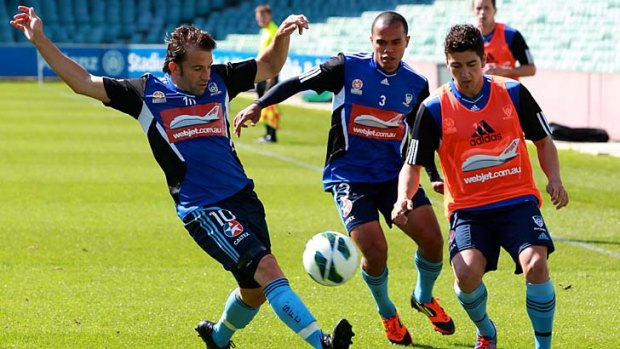 Full stretch ... Alessandro Del Piero moves in to challenge Dimitri Petratos yesterday.