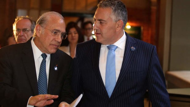 OECD secretary-general Angel Gurria with Treasurer Joe Hockey in February. Mr Gurria said a carbon tax or emissions trading scheme was the most efficient way to cut greenhouse gases.