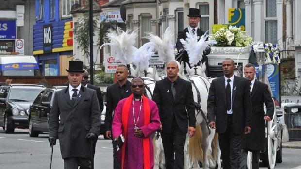 A peaceful procession ... the funeral cortege for Mark Duggan in north London.