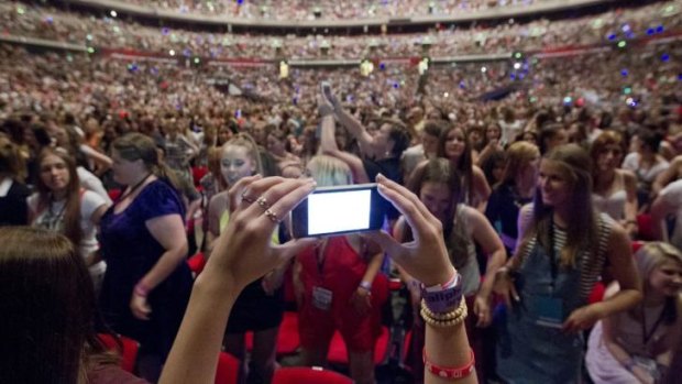 Holding up your phone is now normal behaviour at gigs. A selfie stick takeover seems inevitable. 