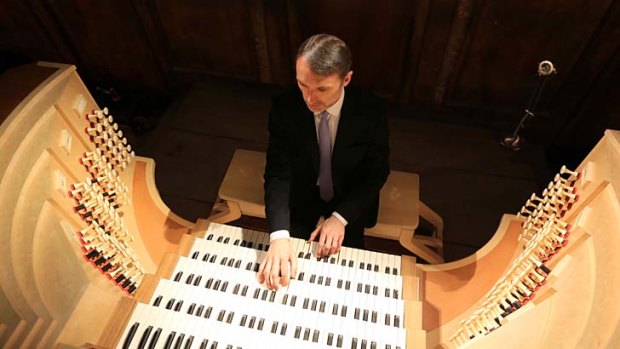 In tune: Oliver Latry at the organ console in Notre Dame Cathedral.