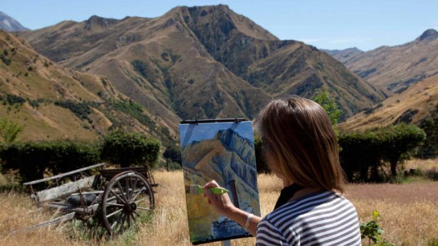 In the picture ... painting in the mountains near Queenstown. The scenery attracts travellers for "art adventure" tours.
