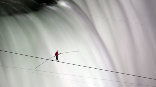 What's more dangerous, walking a tightrope across Niagara Falls - US acrobat Nik Wallenda performs the feat here - or eating a hearty meal of hamburger and chips?