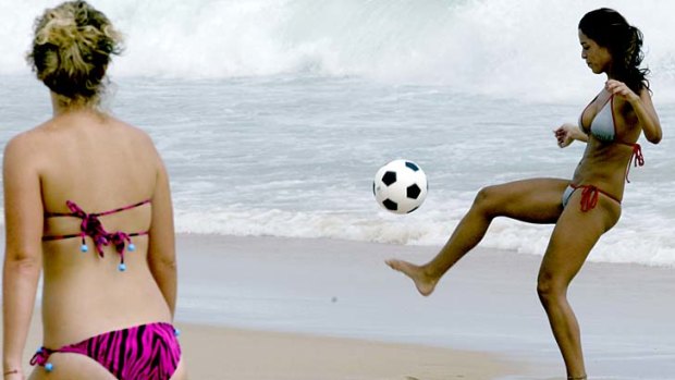 Playing soccer on Ipanema beach.