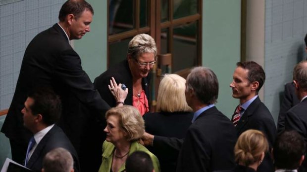 Members of Parliament greet Kaye Baird the mother of the late Corporal Cameron Baird VC MG and his brother Brendan.