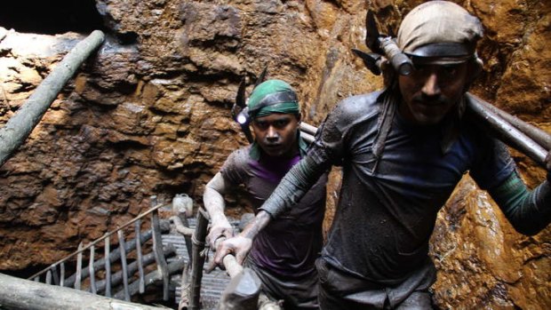 "I don't like this work, but I have to do it": Gayasuddin, at rear, has been a miner since he was 12.