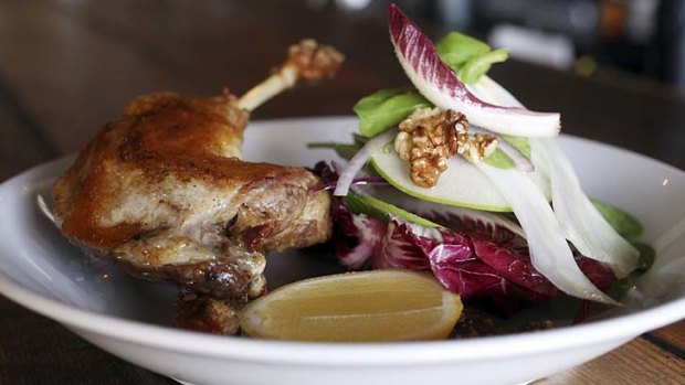 Confit duck leg with apple, fennel and walnut salad.
