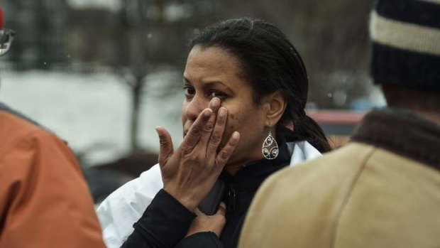 Tarah William of Lanham, Maryland reacts after she was evacuated from a building following a shooting at a shopping mall in Columbia, Maryland.
