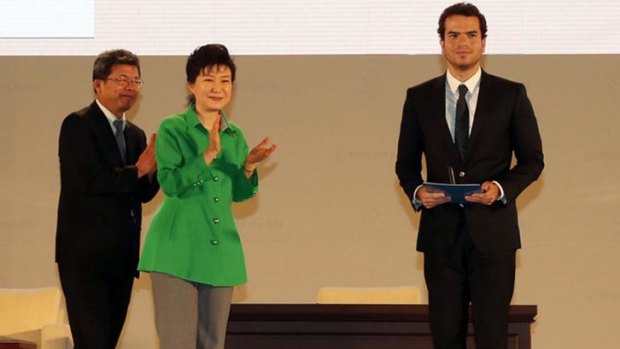 South Korean President Park Geun-Hye gives a medal to Artur Avila.