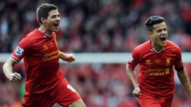 Liverpool's Steven Gerrard celebrates with Philippe Coutinho after the third goal against Manchester City.