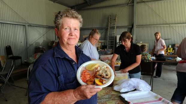 Gail Butt, of Young, helps locals co-ordinate the food and beverage supplies for the fire crews battling blazes near Bookham on the Southern Tablelands.