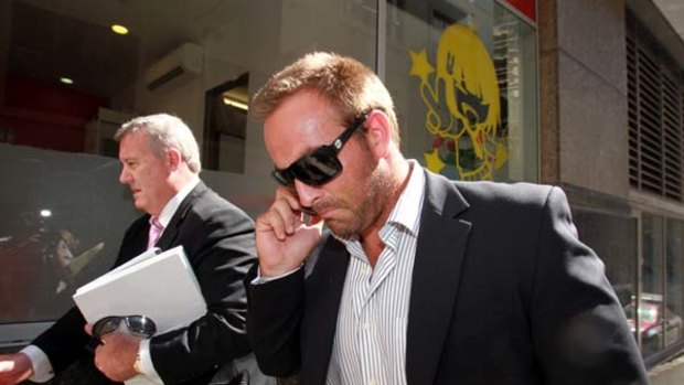 Drama ... Ryan Tandy leaves a city police station on Wednesday, the day he was charged with giving false evidence to the NSW Crime Commission.