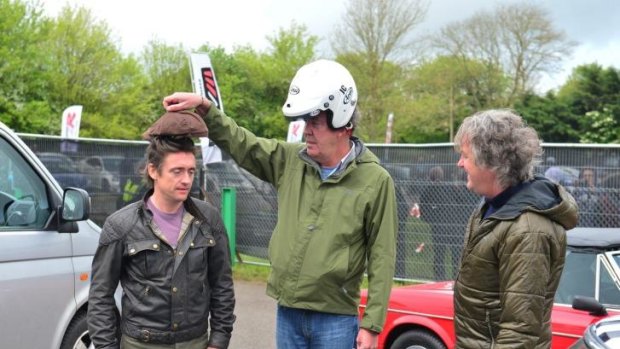 Richard Hammond, Jeremy Clarkson and James May mess around on set.