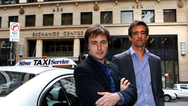 Andrew Campbell and Ned Moorfield of goCatch with a cab outside their office in Sydney.