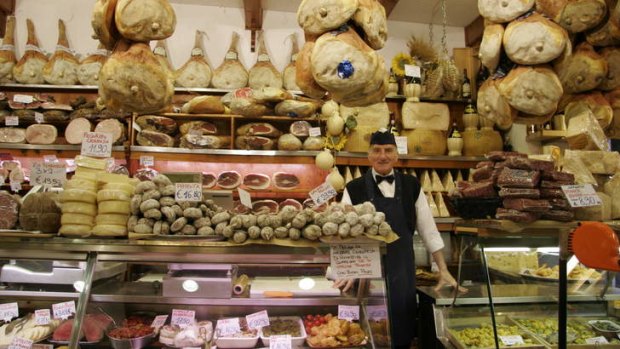 Tradition: A butcher posing in his Bologna deli.