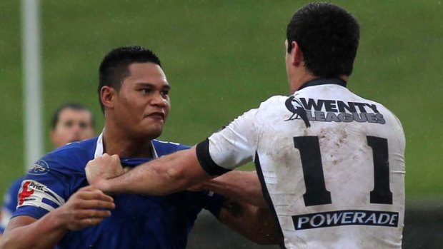 In blue &#8230; Rooster BJ Leilua shapes up to Wentworthville's Pat O'Hanlon while playing for Newtown.