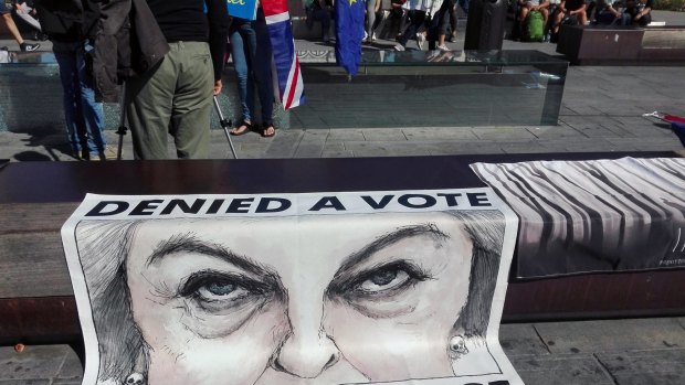 A poster showing British Prime Minister Theresa May displayed during a protest staged by a group of UK citizens living in Italy.