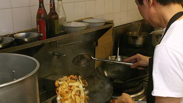 John Chan from Singapura Eating House prepares Char Kway Teow.