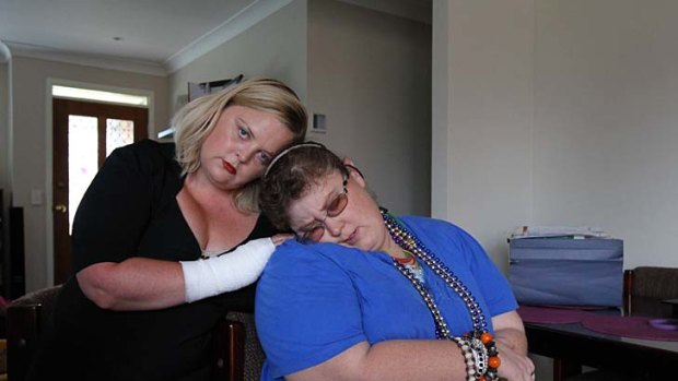 Sceptical ... Karen Vella, left, with her sister Renee Barr, who was born with fragile X syndrome, restricting her cognitive abilities to those of a small child.