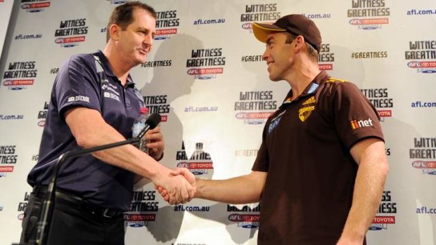 Shake: Ross Lyon and Alastair Clarkson on Friday.