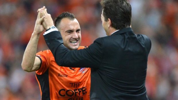 Roar power: Ivan Franjic celebrates with Mike Mulvey during the semi-final against Melbourne Victory in April.