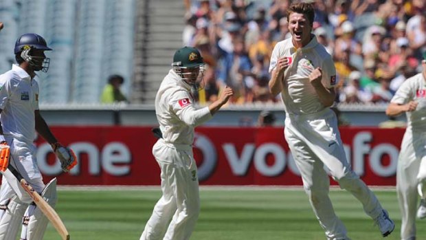 The moment ... Australia's Jackson Bird celebrates his first Test wicket.
