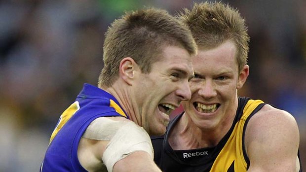 Eagles defender Beau Waters contests with Tigers full forward Jack Riewoldt.