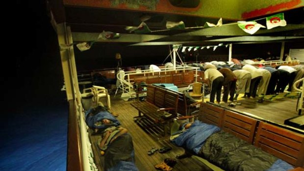 Activists sleep and pray on the Turkish passenger ship MV Marmara carrying 600 activists, part of the freedom flotilla headed to Gaza.