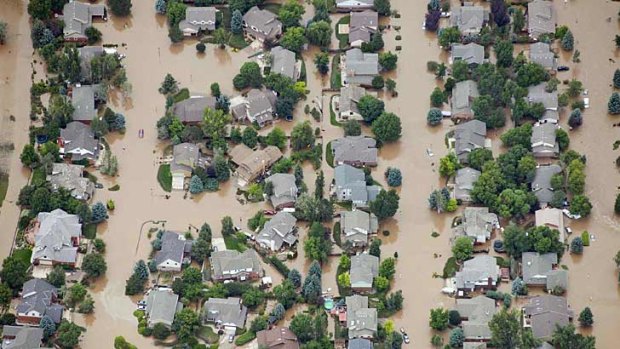 An aerial view of suburban streets flooded in Longmont, Colorado.