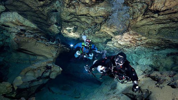 Dark heart ... Divers explore Tank Cave.