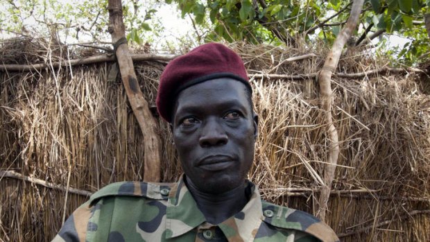 Ceasar Acellam, a senior member of the Lord's Resistance Army, speaks to the press at a Ugandan army base in Djema.