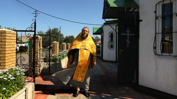 Father Oleg Aliluyko at his church in Rassypnoe.