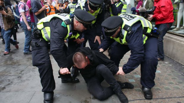 A protester detained in London. Next week will see Enniskillen in Northern Ireland host the two day G8 summit where international leaders including Britain's Prime Minister David Cameron and US President Barack Obama take part in the two day event.