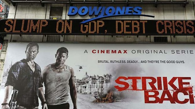 Even the advertising billboards seem to be urging President Obama to ''strike back'' as the Dow Jones ticker heralds the crisis.