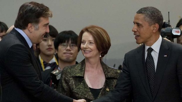 Agreed &#8230; Julia Gillard looks on as the US President, Barack Obama, greets Georgia's President, Mikheil Saakashvili. The summit brought consensus on the need to tackle the illicit trade in nuclear materials.